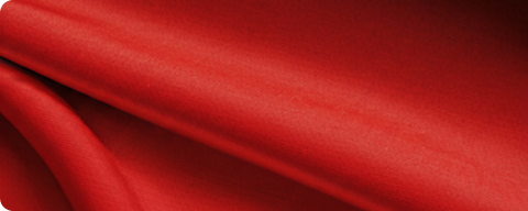 close look at red fabric with details